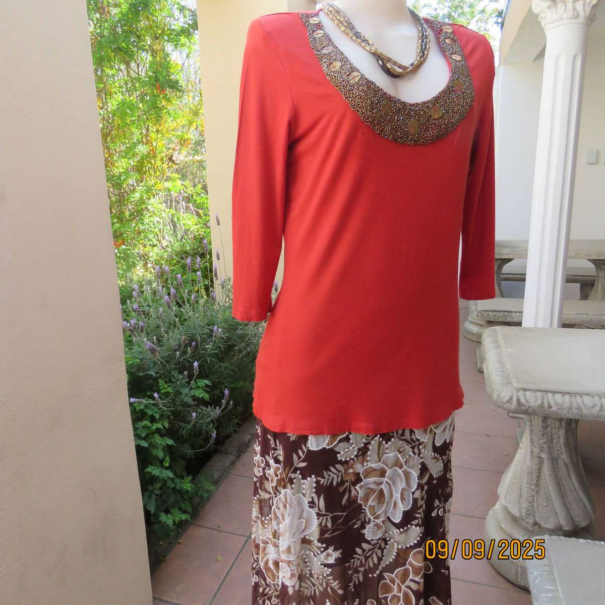 WOOLWORTHS burnt orange stretch viscose top with antique gold neckline embellishment. Size 38