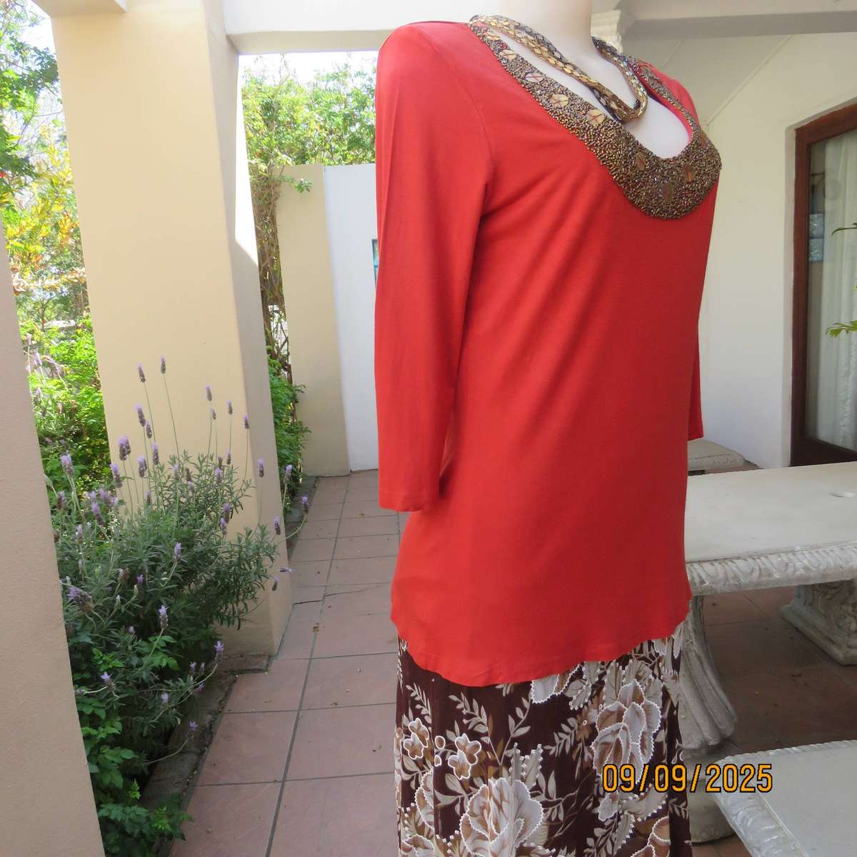 WOOLWORTHS burnt orange stretch viscose top with antique gold neckline embellishment. Size 38