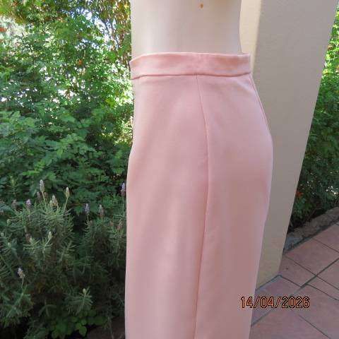 Light peach polyester pencil skirt with back zip and pleat, size 36