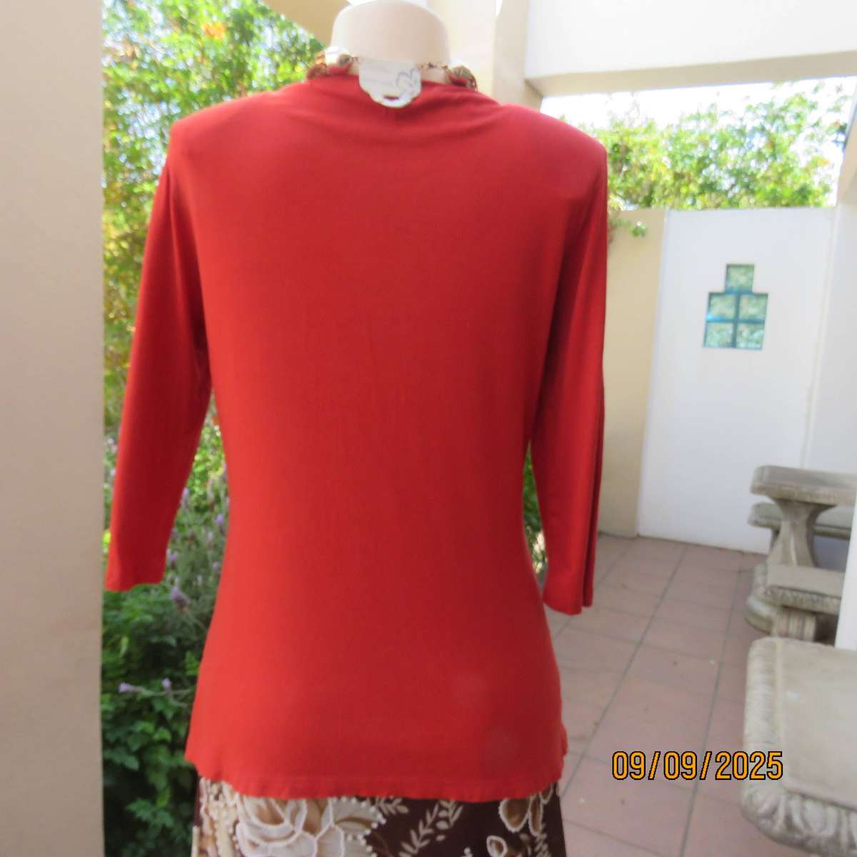 WOOLWORTHS burnt orange stretch viscose top with antique gold neckline embellishment. Size 38