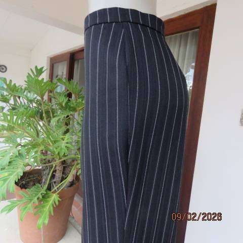 CONTEMPO black stretch polyester with white and embossed vertical stripes. Size 40