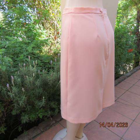 Light peach polyester pencil skirt with back zip and pleat, size 36