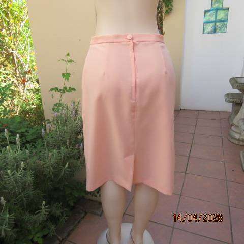 Light peach polyester pencil skirt with back zip and pleat, size 36