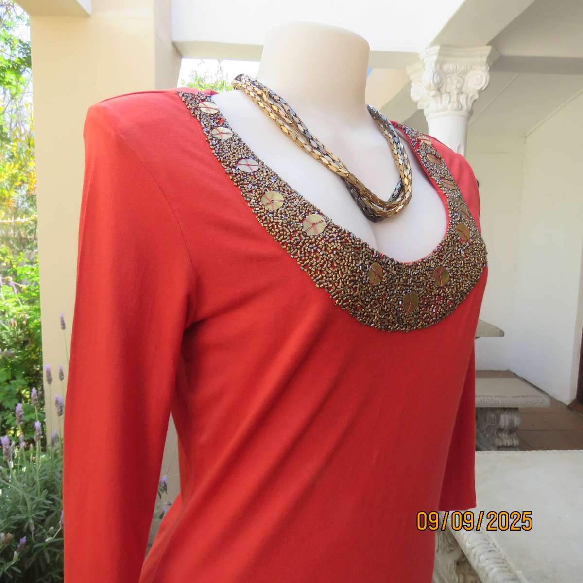 WOOLWORTHS burnt orange stretch viscose top with antique gold neckline embellishment. Size 38