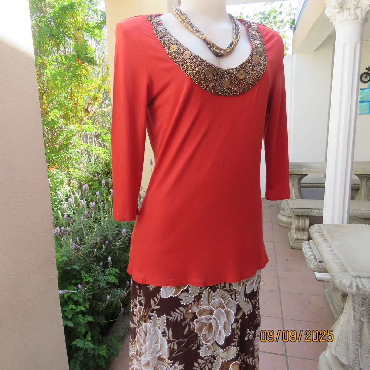WOOLWORTHS burnt orange stretch viscose top with antique gold neckline embellishment. Size 38