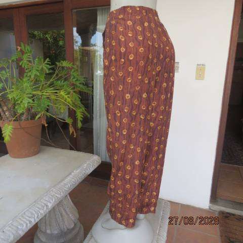 Melrose Studio golden brown silk pants with vertical gold broken stripe print, size 36