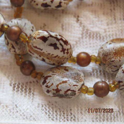 Bohemian handmade necklace with castor beans and brown beads, 78cm length