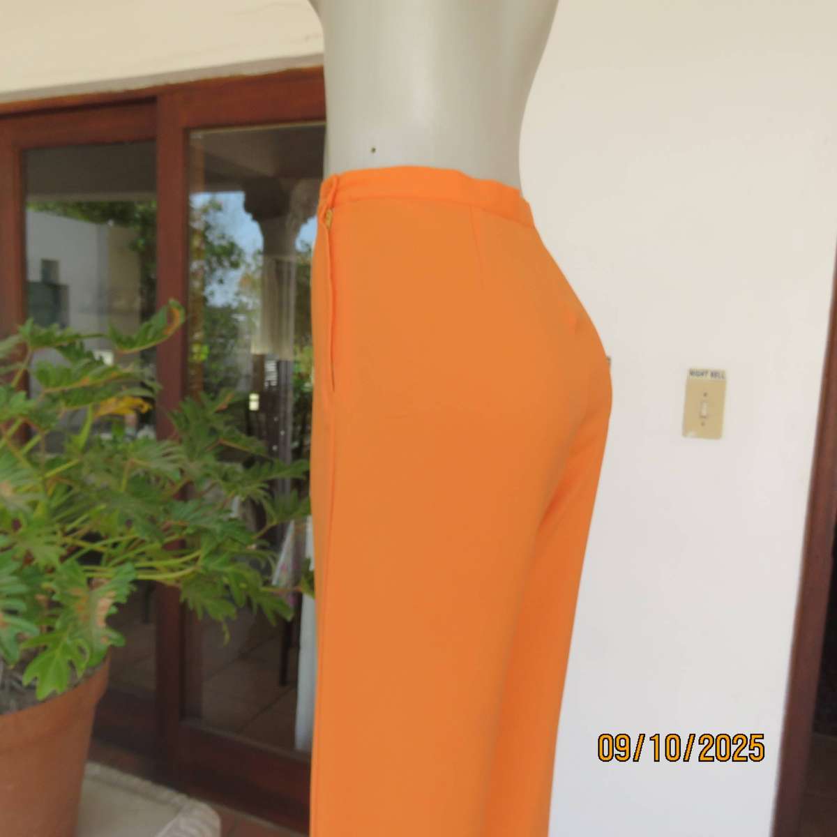 Tangerine orange ankle length textured polyester pants. Side zip. Size 38.
