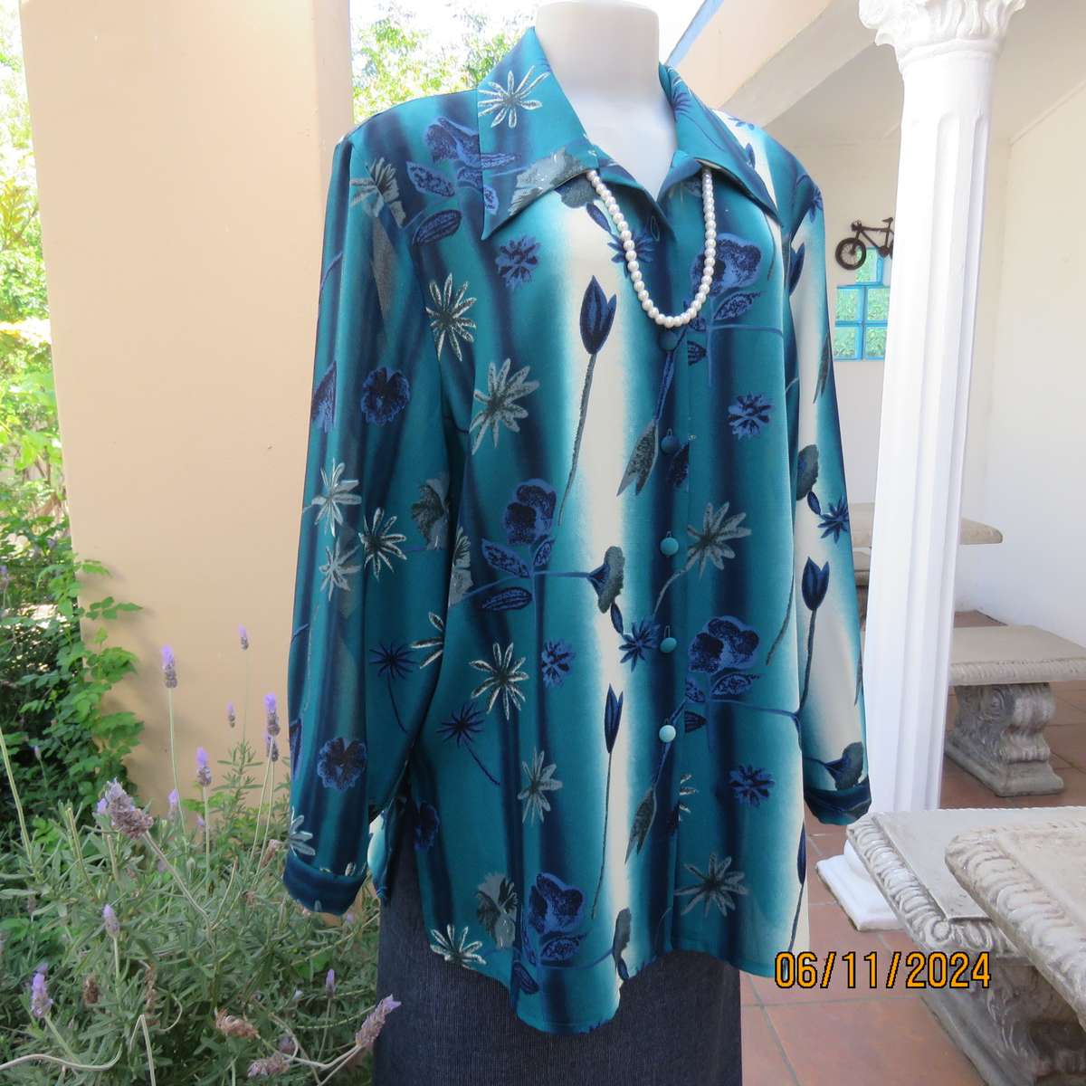 Smart long cuffed sleeve RENE TAYLOR text. polyester top in jade-blue shades.Floral design.Size 42