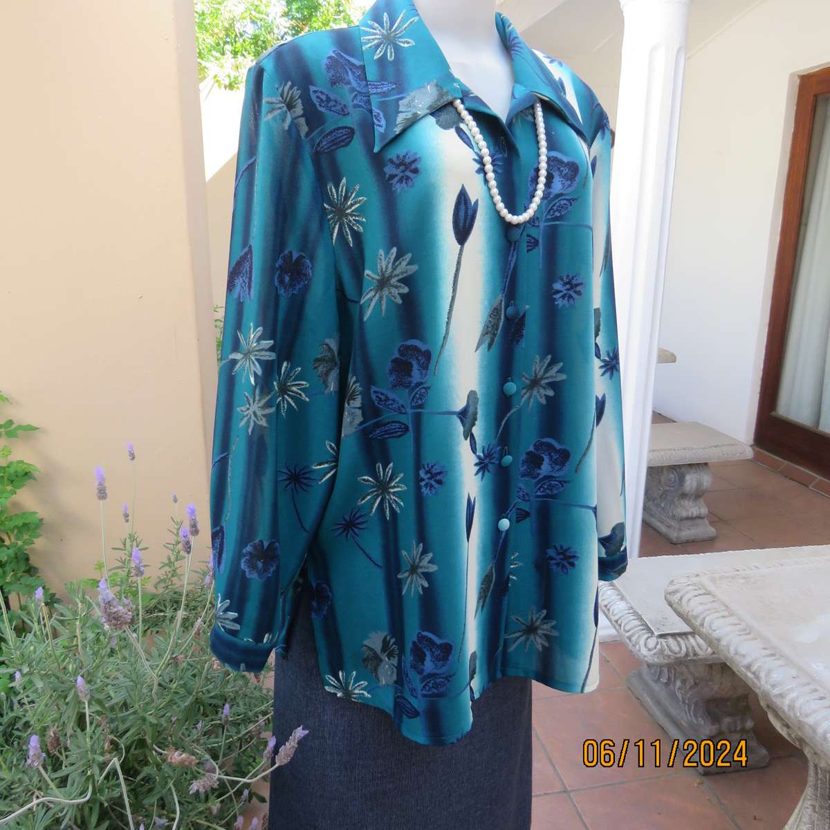 Smart long cuffed sleeve RENE TAYLOR text. polyester top in jade-blue shades.Floral design.Size 42