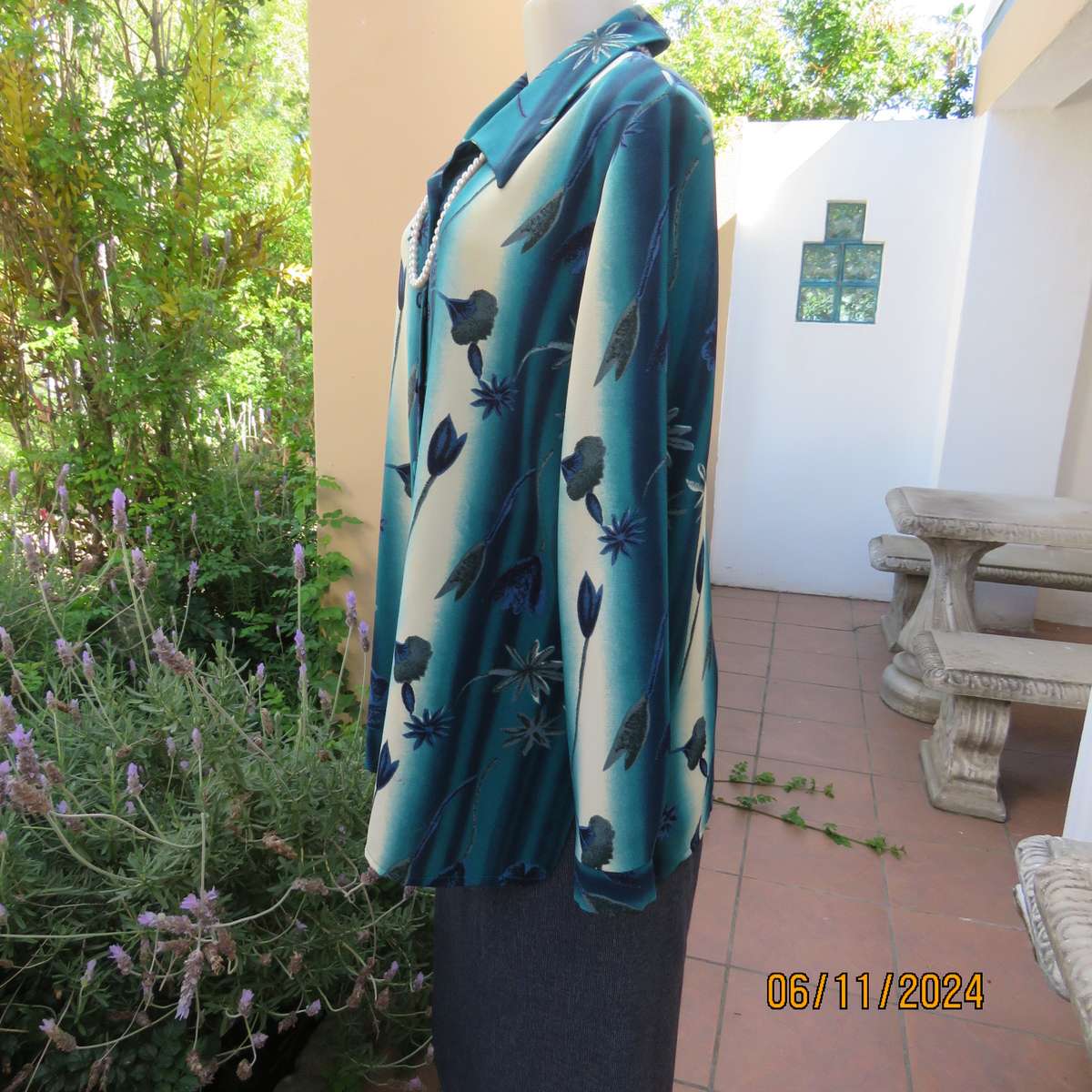 Smart long cuffed sleeve RENE TAYLOR text. polyester top in jade-blue shades.Floral design.Size 42