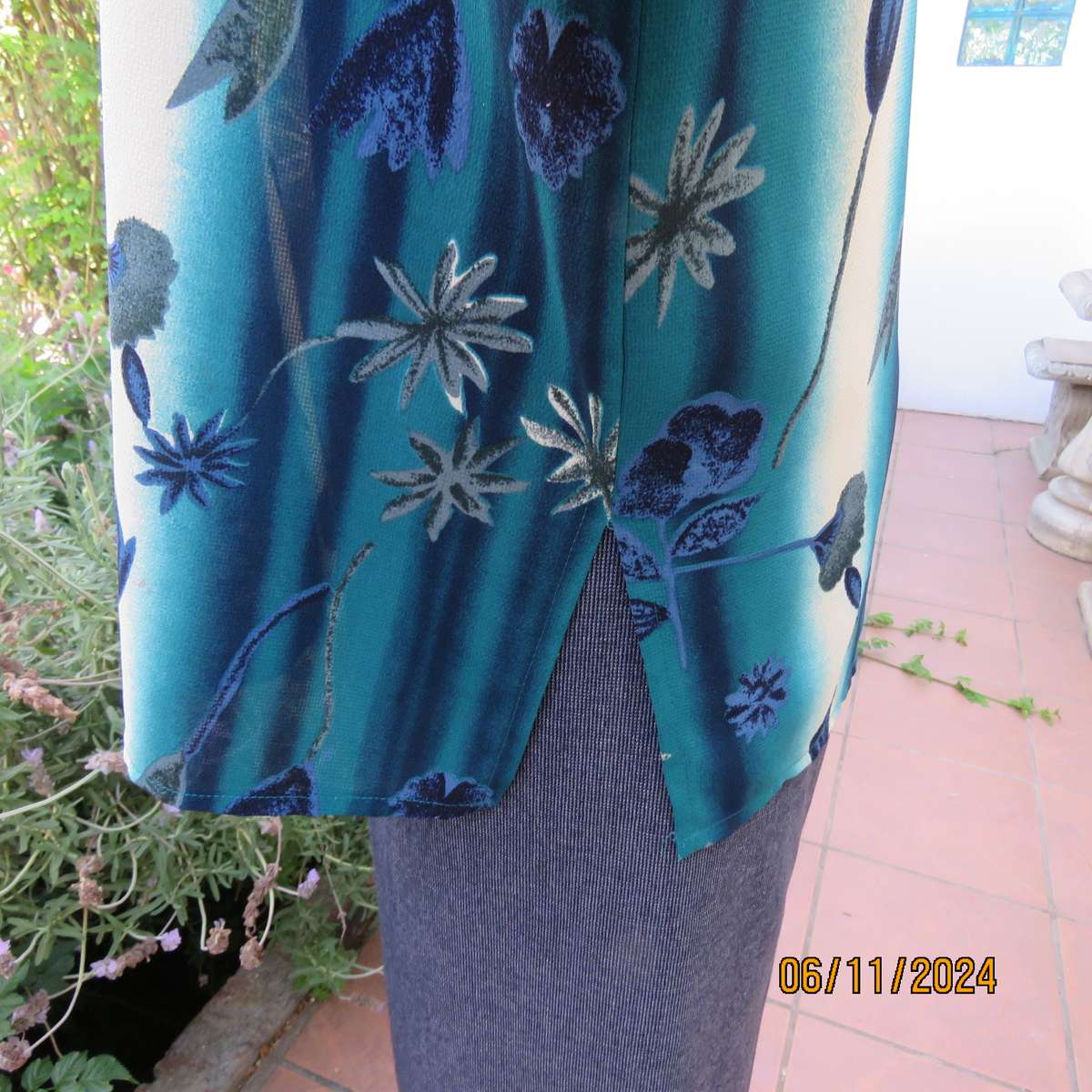 Smart long cuffed sleeve RENE TAYLOR text. polyester top in jade-blue shades.Floral design.Size 42