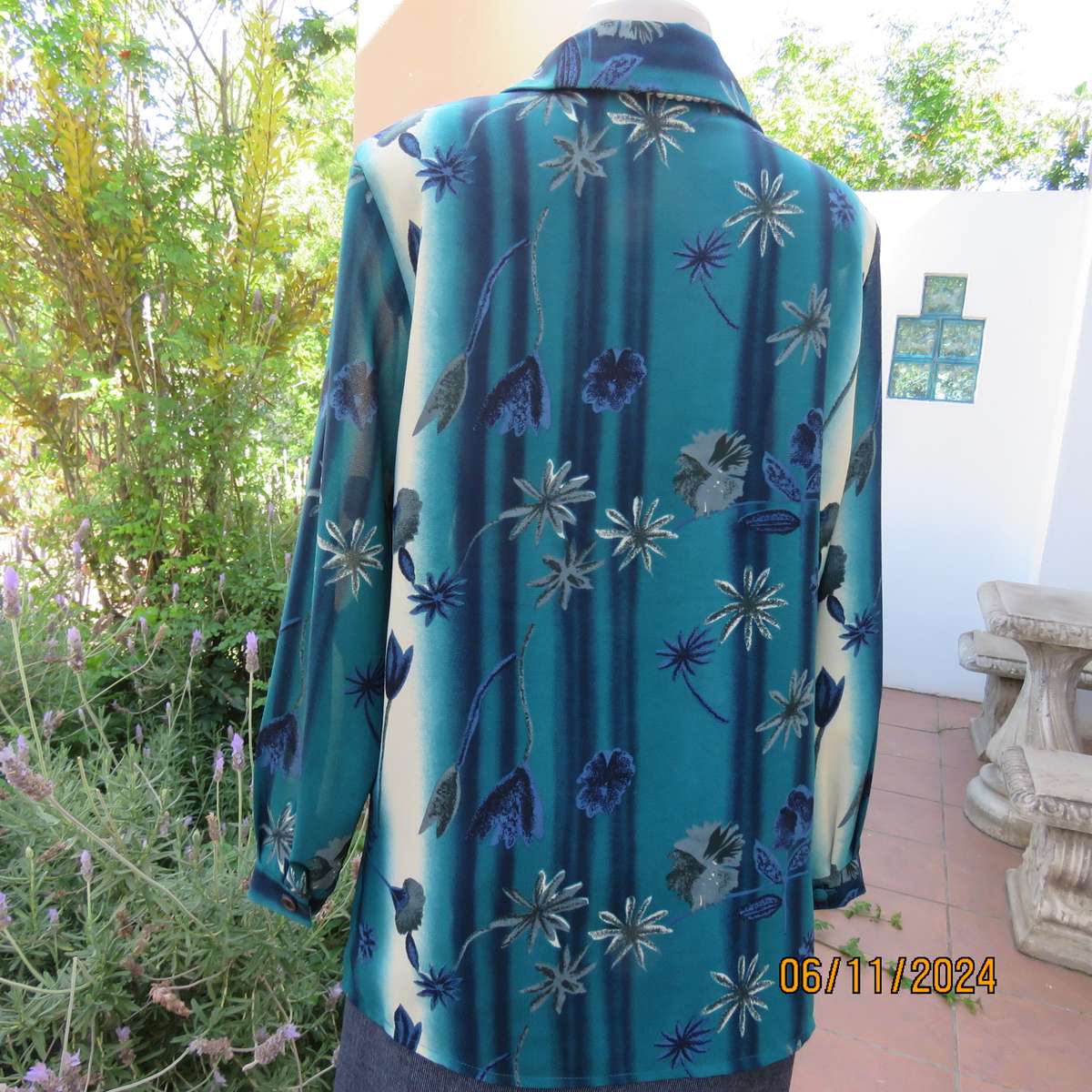 Smart long cuffed sleeve RENE TAYLOR text. polyester top in jade-blue shades.Floral design.Size 42