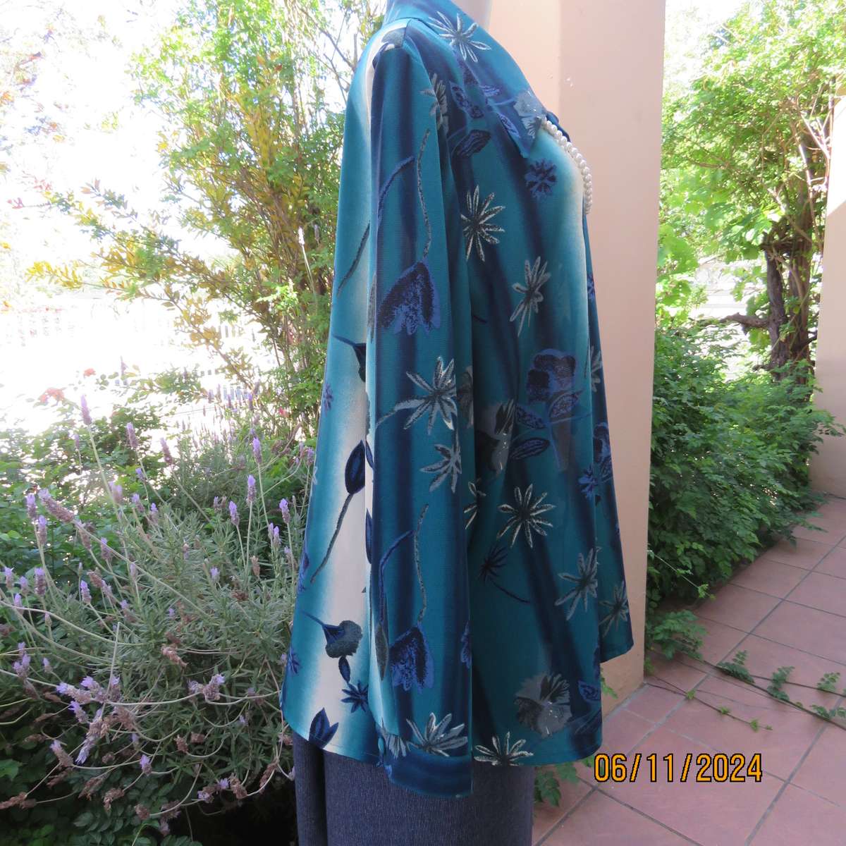 Smart long cuffed sleeve RENE TAYLOR text. polyester top in jade-blue shades.Floral design.Size 42