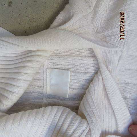 White ribbed long sleeve cotton-acrylic knit pullover cardigan. Wide high collar open sided. Size 38
