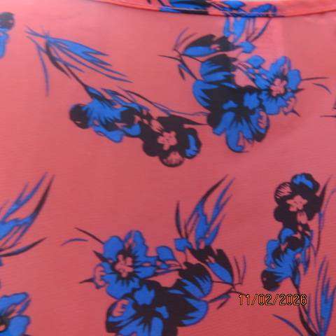 Cool crimson sleeveless slip over top with blue-black floral print in polyester. Size 40-42