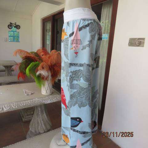 Wide legged aqua thick cotton pants with colourful print. Cotton stretch wide waistband. Size 40-42