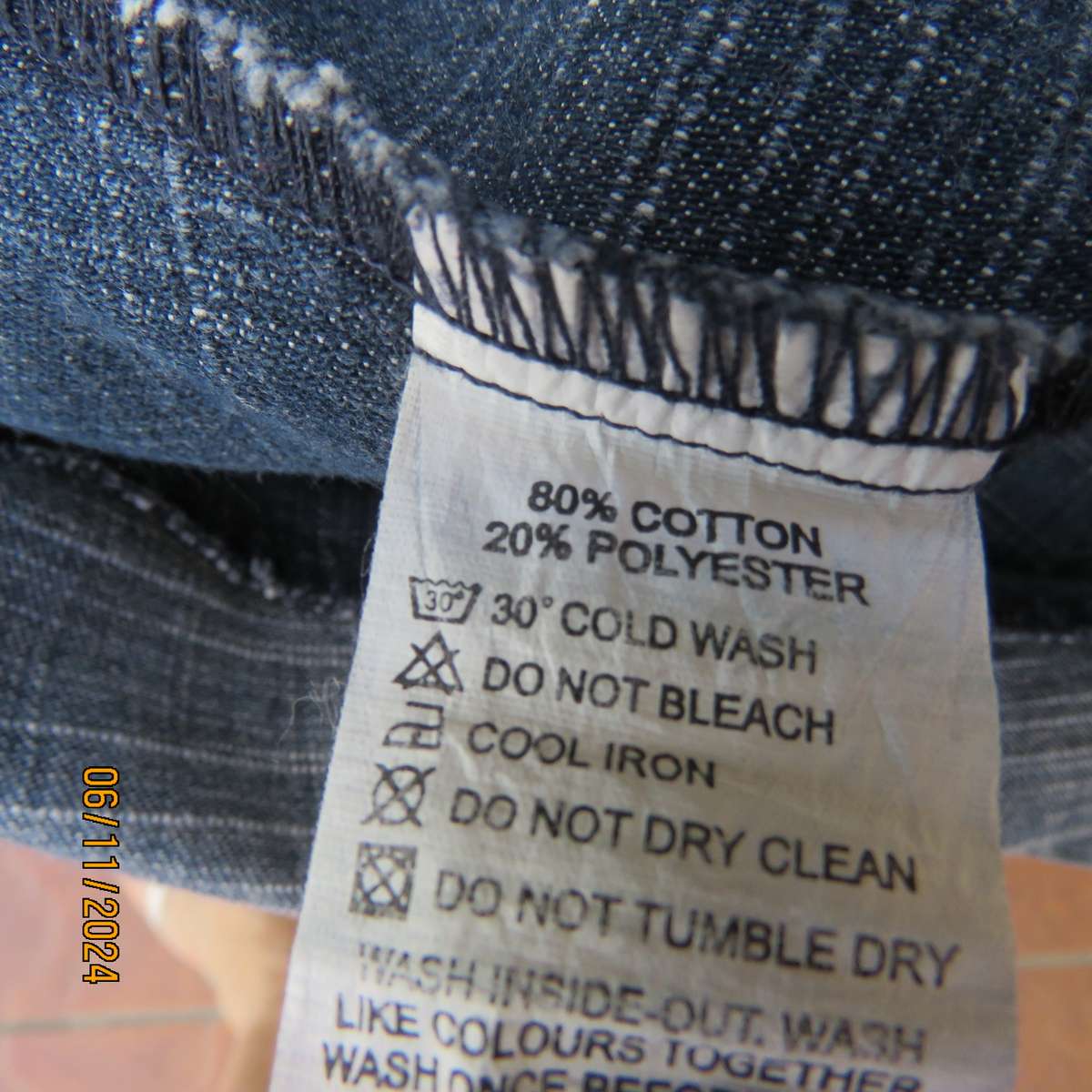 Blue denim skirt in horizontal panels with cord decoration Size 38-40.Polycotton. Elasticated waist.