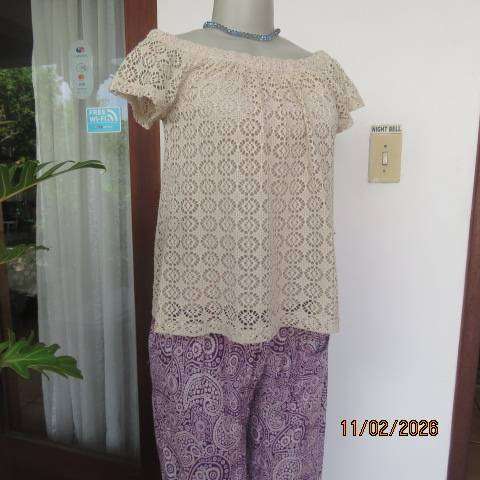 Rich cream polyester 2 layer off the shoulder elasticated top. Lace overlay. Size 30