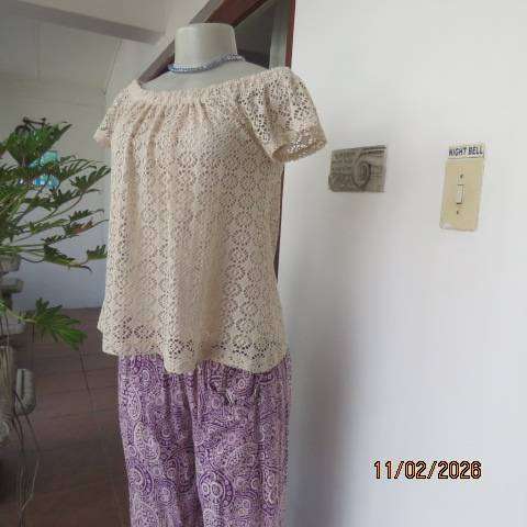 Rich cream polyester 2 layer off the shoulder elasticated top. Lace overlay. Size 30