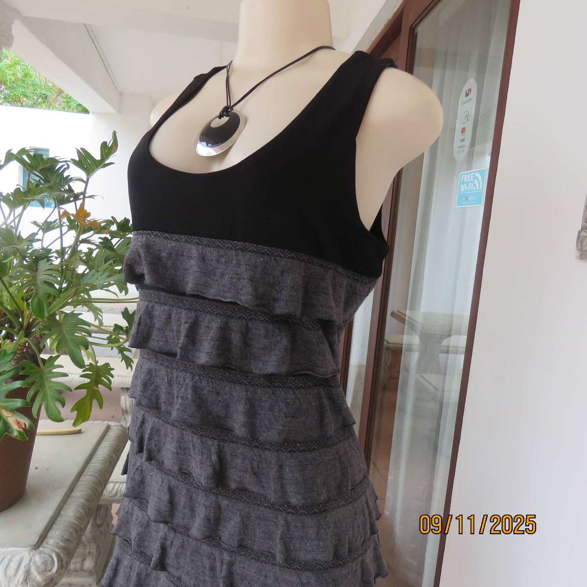 OASIS black stretch poly-rayon slip over sleeveless dress with grey ruffles. Size 36