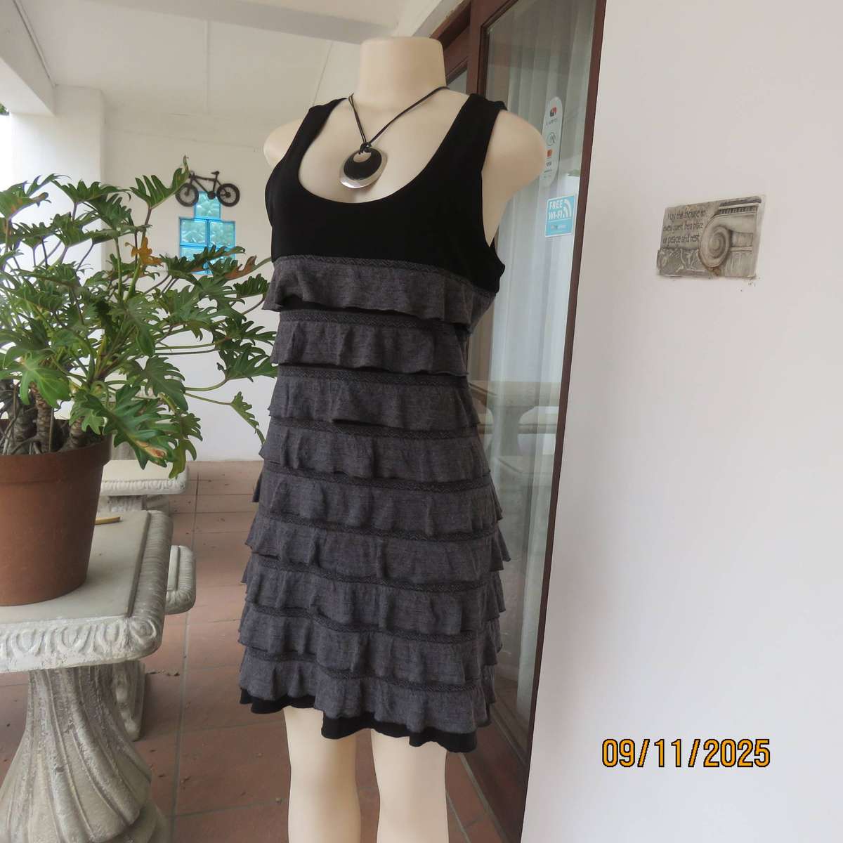 OASIS black stretch poly-rayon slip over sleeveless dress with grey ruffles. Size 36