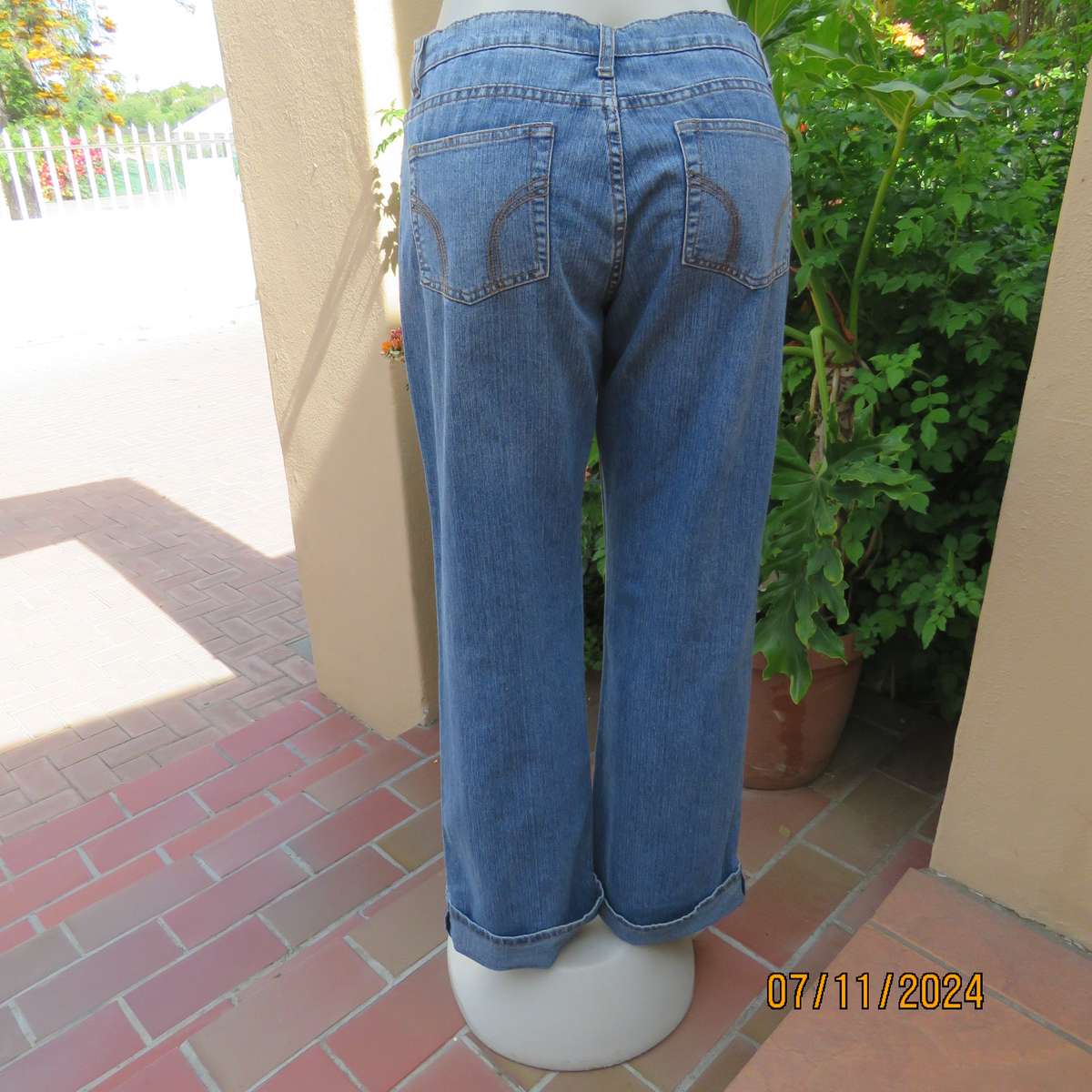 NEWS blue denim straight legged jeans in polycotton stretch. Size 36. Turnovers. Pockets back-front.