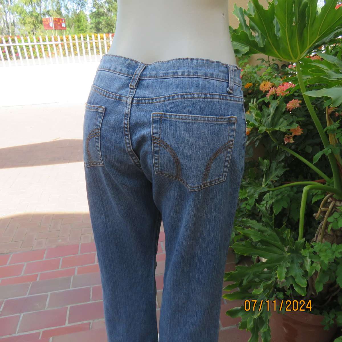 NEWS blue denim straight legged jeans in polycotton stretch. Size 36. Turnovers. Pockets back-front.