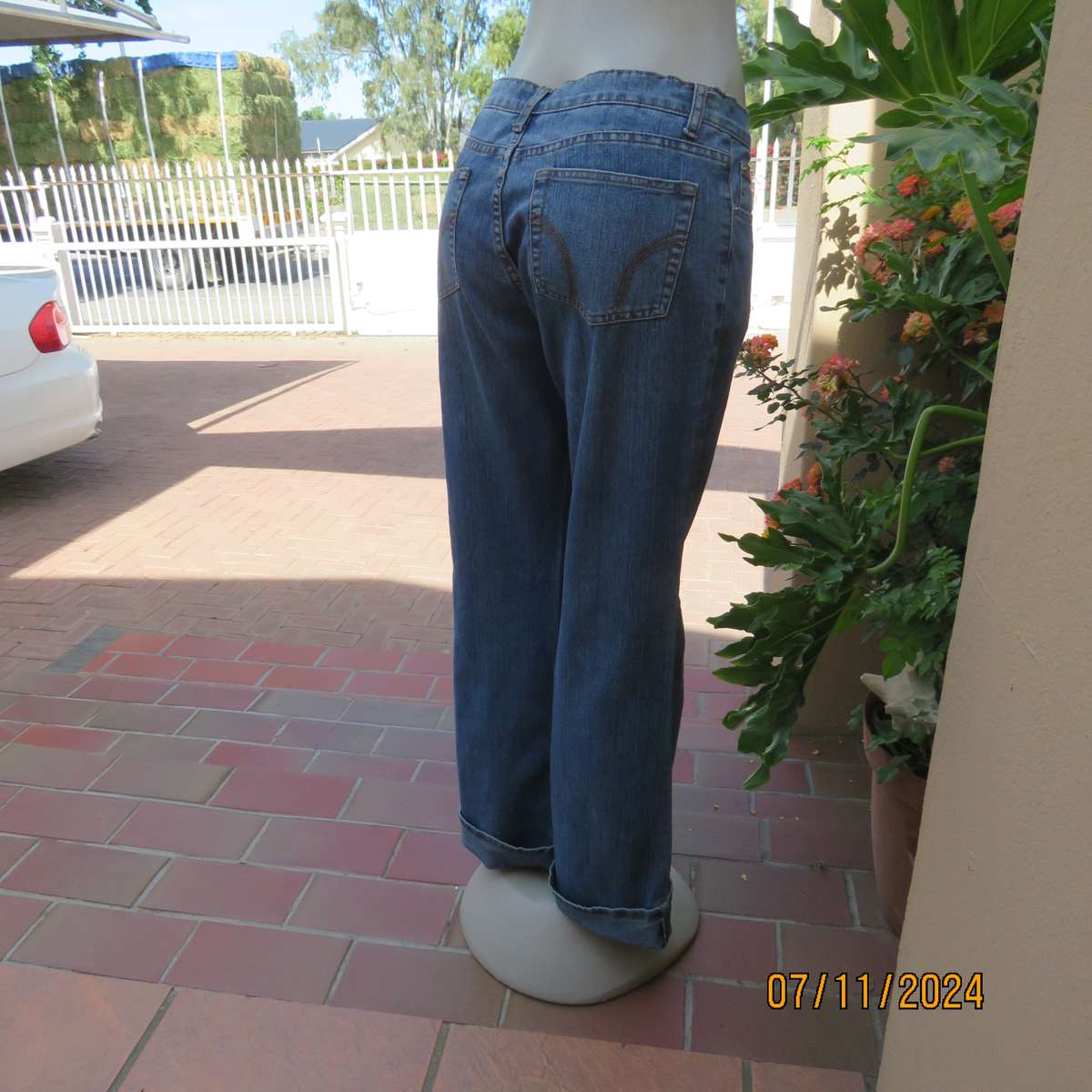 NEWS blue denim straight legged jeans in polycotton stretch. Size 36. Turnovers. Pockets back-front.