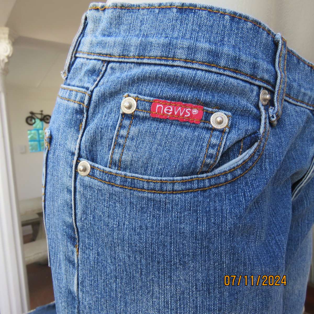 NEWS blue denim straight legged jeans in polycotton stretch. Size 36. Turnovers. Pockets back-front.