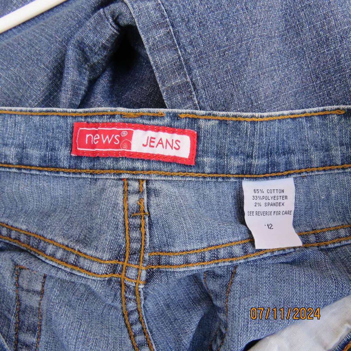 NEWS blue denim straight legged jeans in polycotton stretch. Size 36. Turnovers. Pockets back-front.