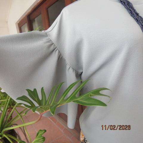 FIX pistachio green slip over textured stretch polyester top. Flare gathered short sleeves. Size 36