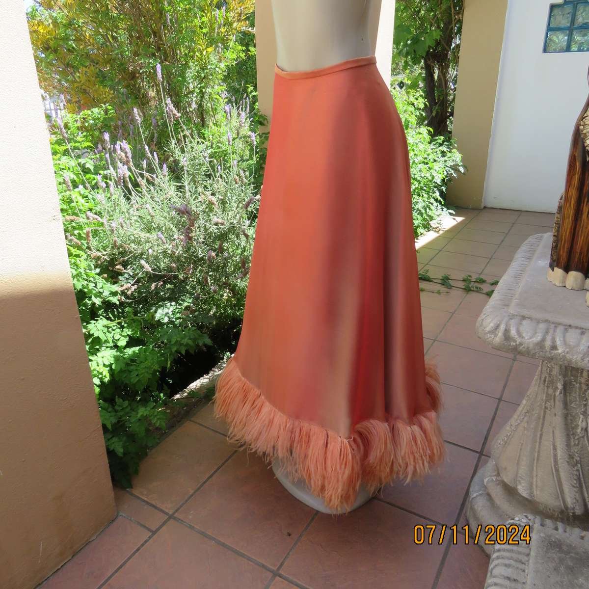 Glamorous half flare peach long skirt-underlay idark crimson satin. Size 36-38.Ostrich feather seam