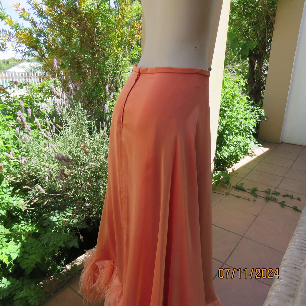 Glamorous half flare peach long skirt-underlay idark crimson satin. Size 36-38.Ostrich feather seam