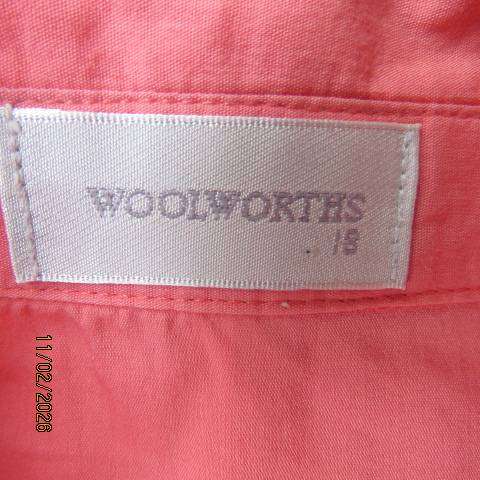 WOOLWORTHS crimson tailored top with hidden button down front. Short cuffed sleeves. Size 42