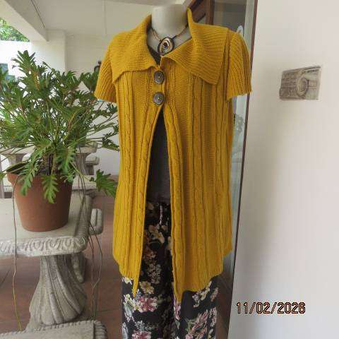Mustard yellow open knitted acrylic long cardigan with tiny capped sleeves. Size 38