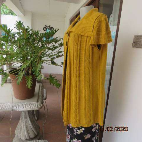 Mustard yellow open knitted acrylic long cardigan with tiny capped sleeves. Size 38