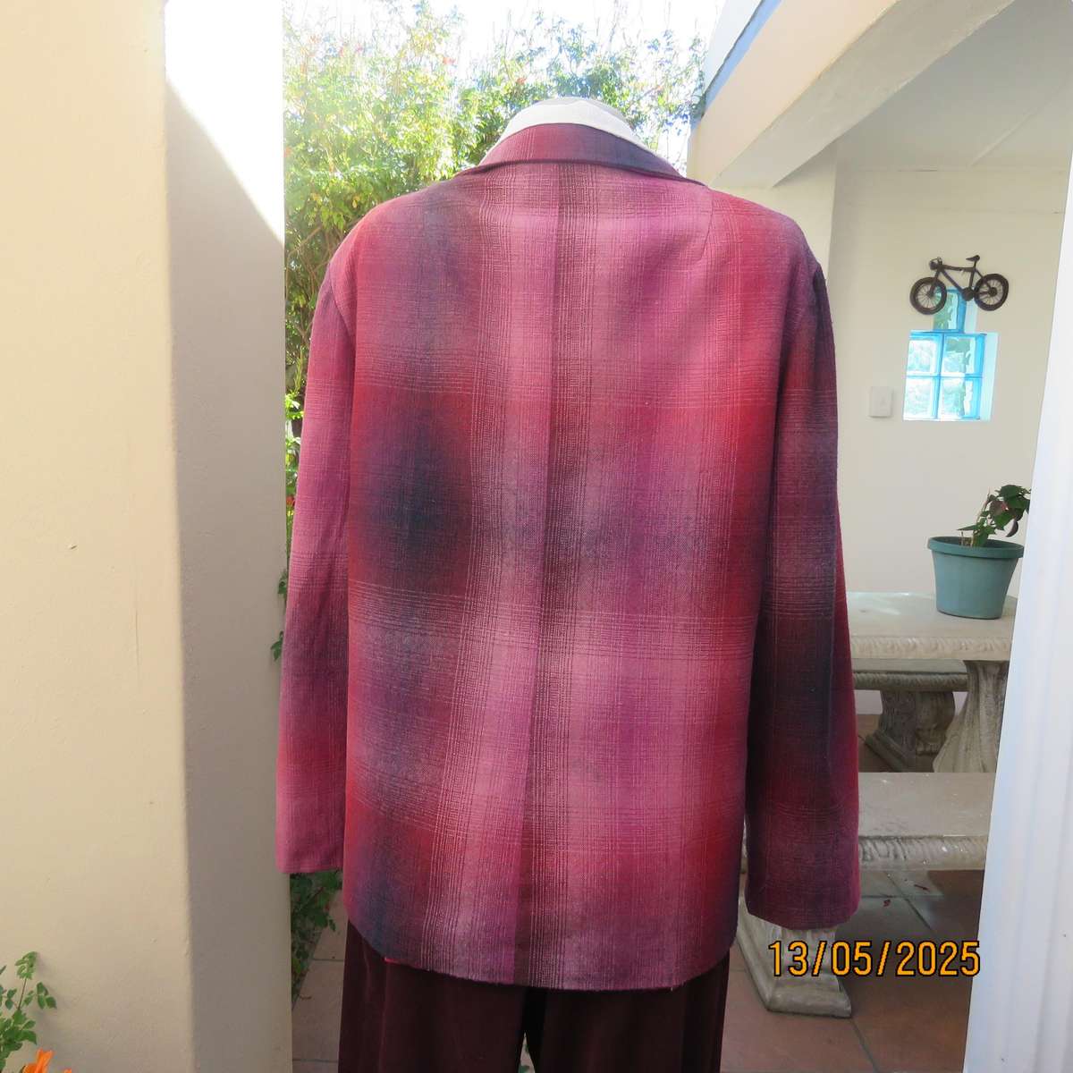 Warm woolen fully lined long sleeve jacket size 40 in reds-pinks and navy.