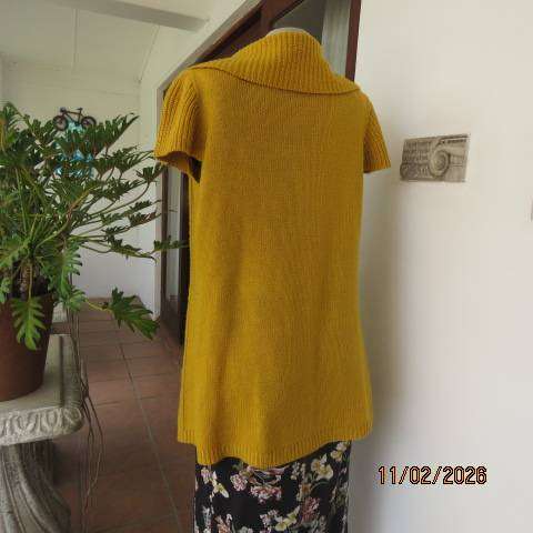 Mustard yellow open knitted acrylic long cardigan with tiny capped sleeves. Size 38