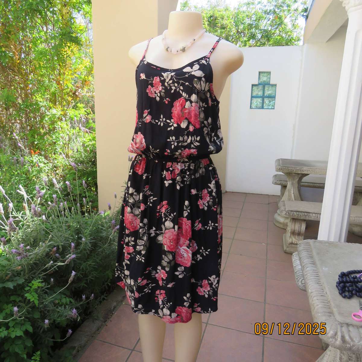 Black 100% rayon strappy dress with bold pink flowers. Size 38