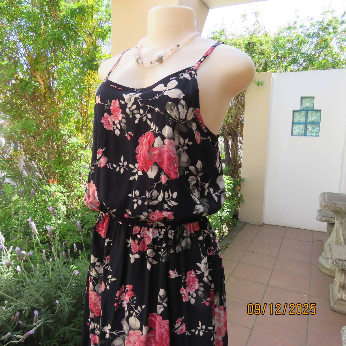Black 100% rayon strappy dress with bold pink flowers. Size 38