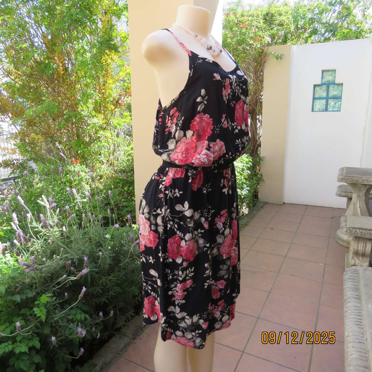 Black 100% rayon strappy dress with bold pink flowers. Size 38