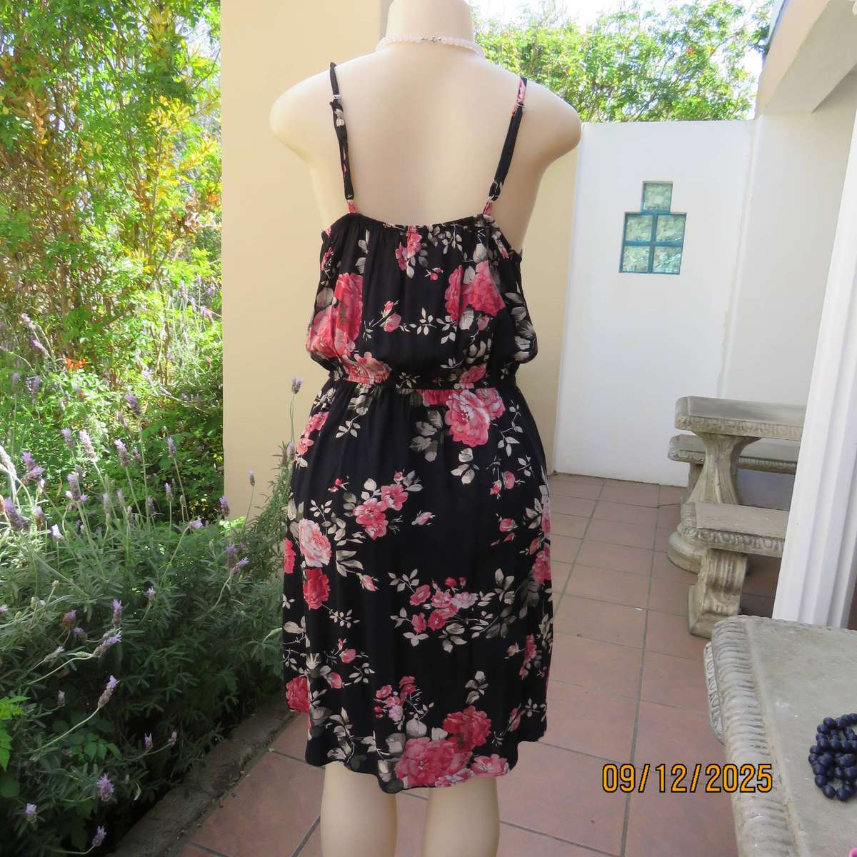 Black 100% rayon strappy dress with bold pink flowers. Size 38