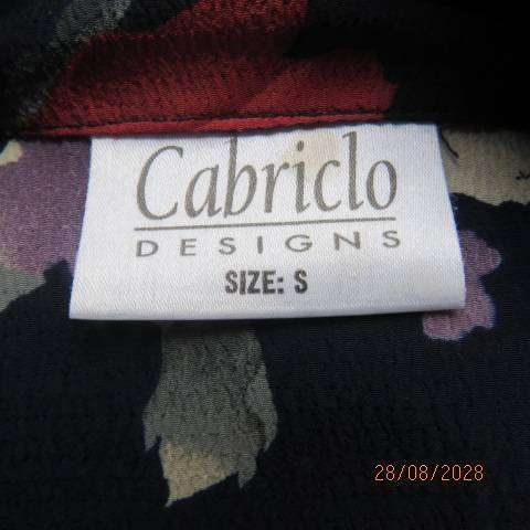 CABRILCO navy textured long sleeve polyester top with lilac, cream & brick floral print, size 40