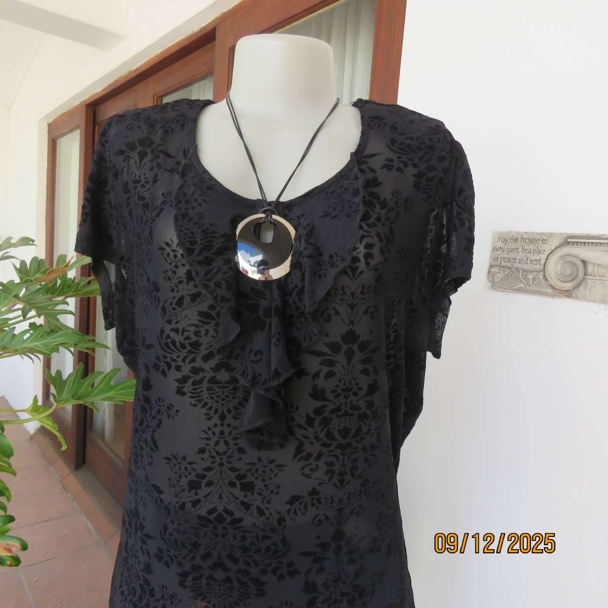 FASHION Express black opaque polyester top with velvety flowers. Size 42