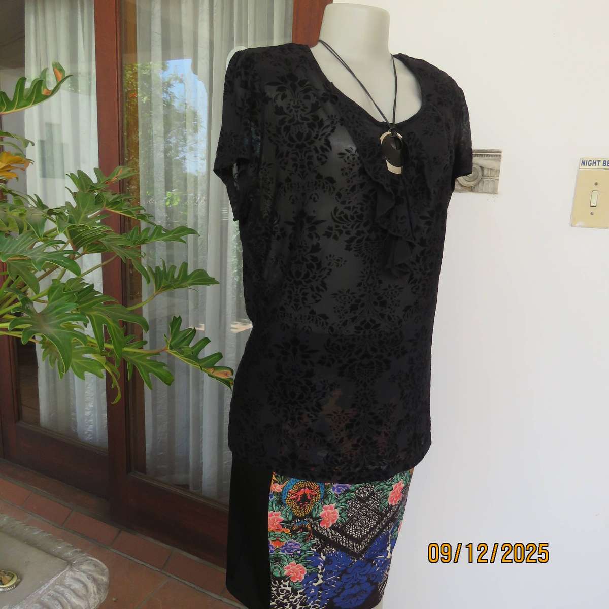 FASHION Express black opaque polyester top with velvety flowers. Size 42