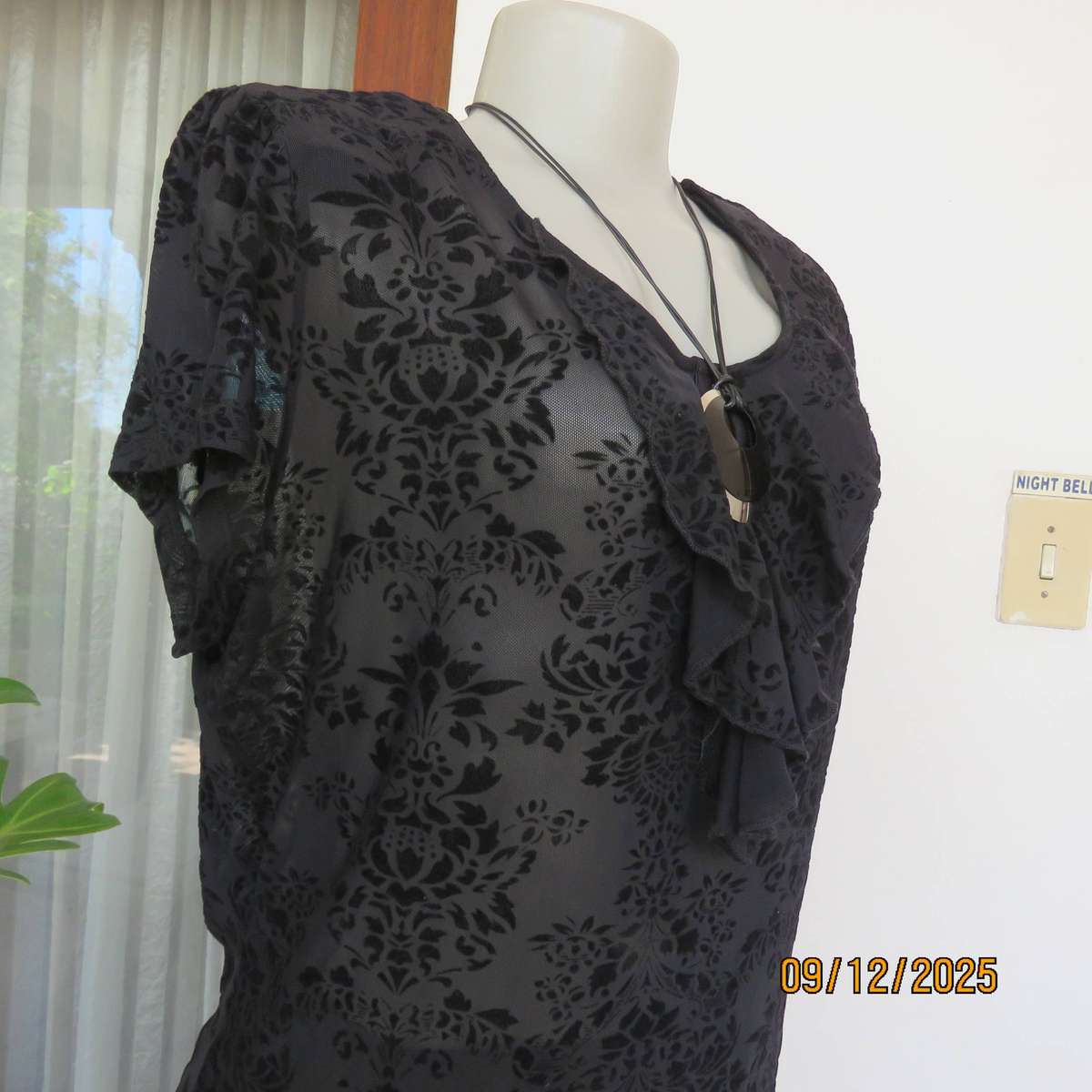FASHION Express black opaque polyester top with velvety flowers. Size 42