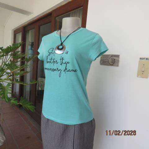 Aquamarine slip over capped sleeve polycotton top with black logo. Size 34
