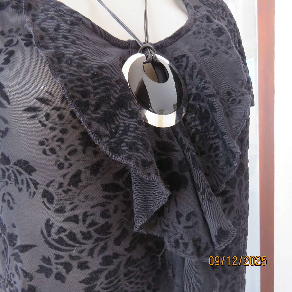 FASHION Express black opaque polyester top with velvety flowers. Size 42