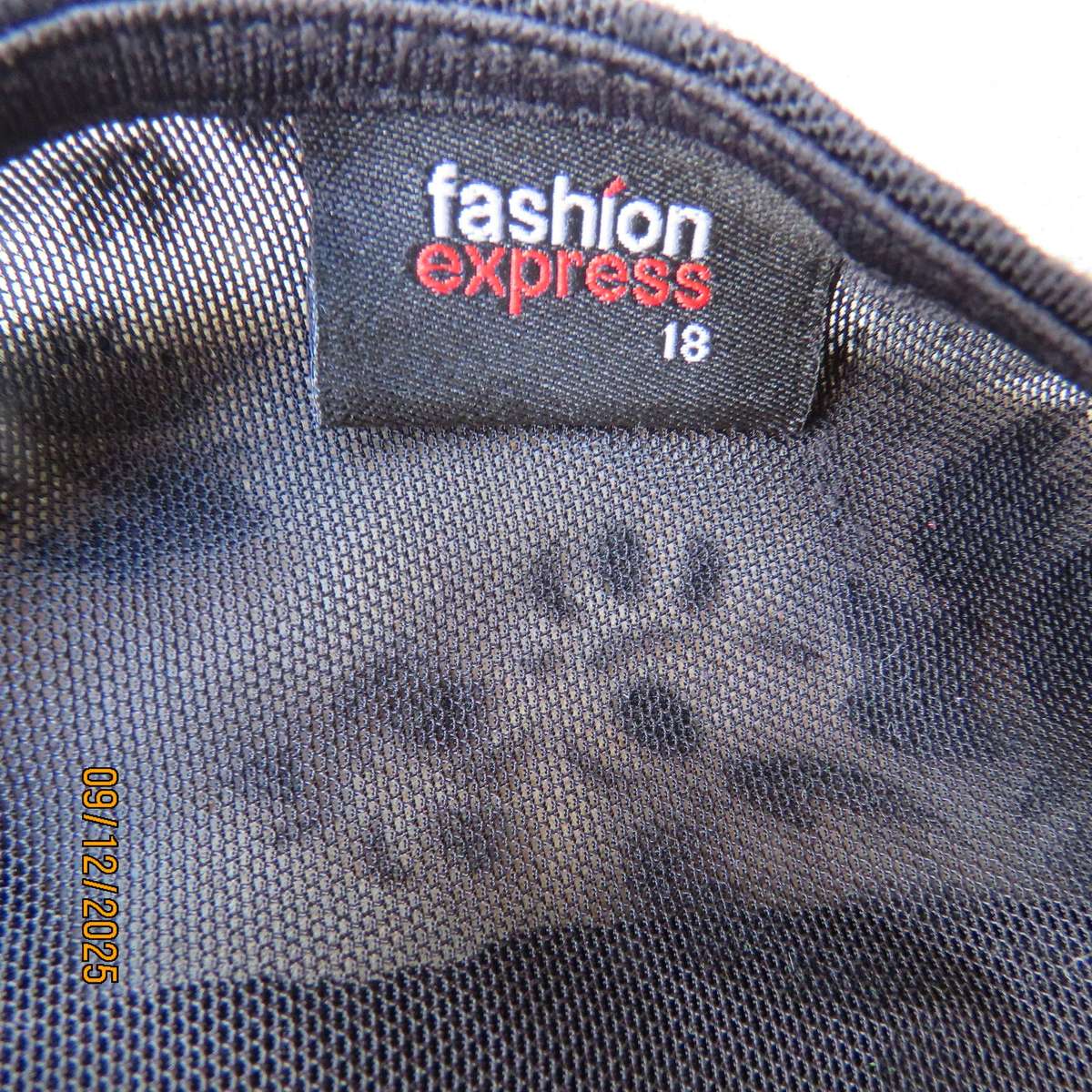 FASHION Express black opaque polyester top with velvety flowers. Size 42